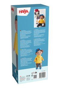 Doll with brown skin, yellow hoodie, gray pants, blue cap, and blue sneakers on blue and white toy box packaging with multilingual text.