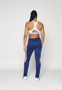 adidas Sportswear TIRO CUT 3 STRIPES TRACKPANTS - Treniņtērpa apakšdaļas - navy blue/white/better scarlet
