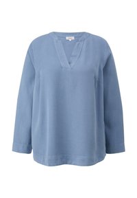 Haut à manches longues bleu clair avec un décolleté en V et une coupe décontractée. Fabriqué en tissu doux avec des accentuations de couture visibles et des fentes sur les côtés à l'ourlet.