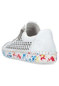 White perforated sneaker with a zip closure, featuring a textured sole with splashes of red, blue, and yellow. Smooth leather accents.