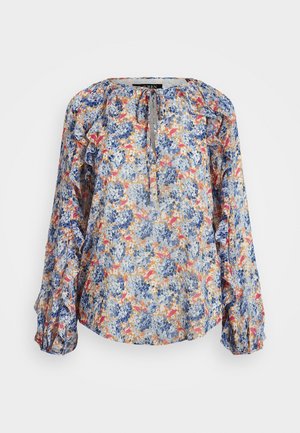 Blusa a stampa floreale in tessuto leggero, caratterizzata da tonalità di blu, arancione e giallo. Maniche a palloncino con polsini elastici e colletto con lacci.