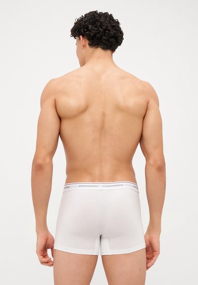 Witte katoenen trunkonderbroek met een merk-elastische tailleband. Heeft een aansluitend ontwerp en een soepele textuur.