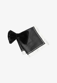 Unselected, black velvet polka dot