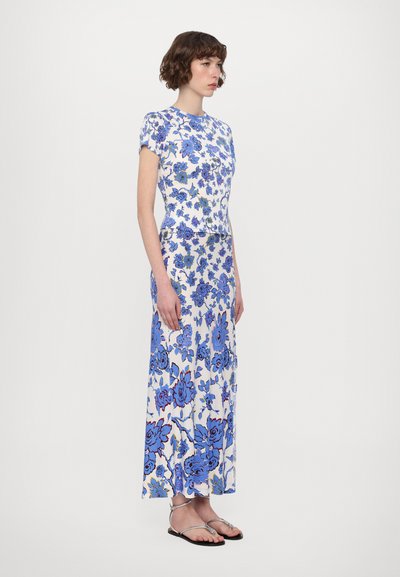 Maxi dress and top set with short sleeves, featuring a white base and bold blue floral pattern; smooth fabric and relaxed silhouette.