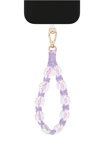 Llavero anudado hecho de tela morada, blanca y rosa con motivos florales, con un clip dorado para sujeción.