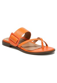 Orange flat sandals with a textured wide strap, narrow toe post, and a large decorative buckle. Smooth sole and subtle brown accents.