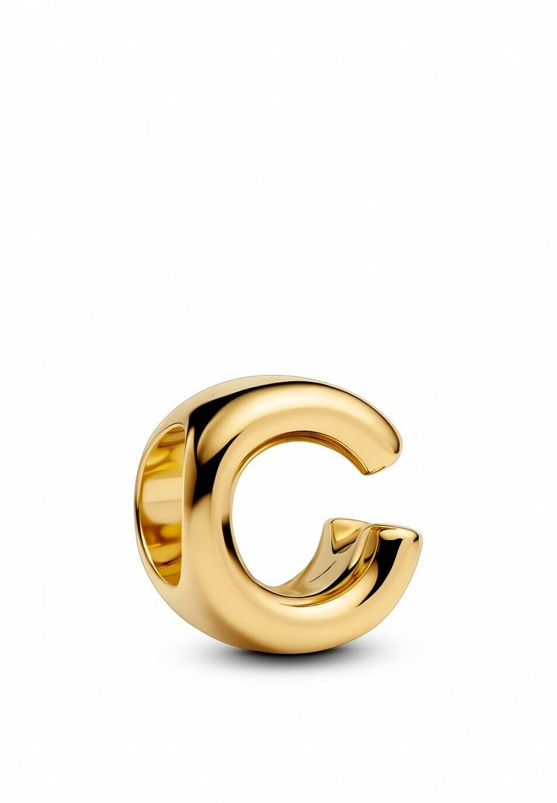 Anello in oro a forma di lettera "G" con un design arrotondato e scultoreo. Texture liscia con finitura lucida, che mette in mostra un centro cavo.