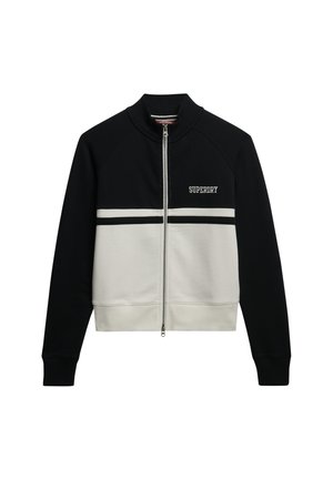 Czarna i kremowa kurtka na zamek z wysokim kołnierzem, z logo "SUPERDRY" na piersi i kontrastowymi poziomymi paskami. Miękka tkanina.