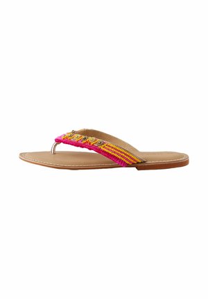 Flat thong sandal with a tan leather sole. Features a multicolored woven strap in pink and yellow, adorned with decorative accents.