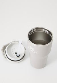 Light gray insulated tumbler with a metallic interior and removable lid featuring a white straw, embossed logo, and sleek curved design.