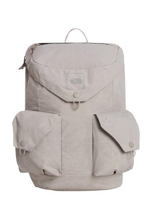 Light gray North Face backpack with a top flap, two front buttoned pockets, and a small carrying loop on top.