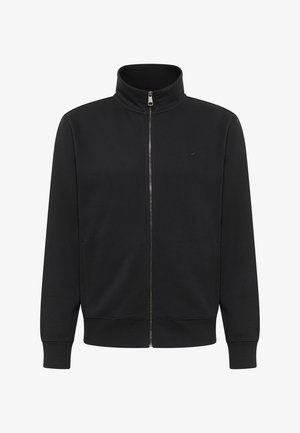 Mustmust järk-järgne kraega must zip-up jakk, mis on valmistatud pehmest kangast. Omab soonikkoes mansette ja sälgitud serva, ning nõtket logo rinnal.