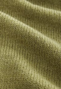 Olive green knitted fabric, featuring a textured rib pattern. The weave appears soft with slight fuzziness and a consistent, uniform look.