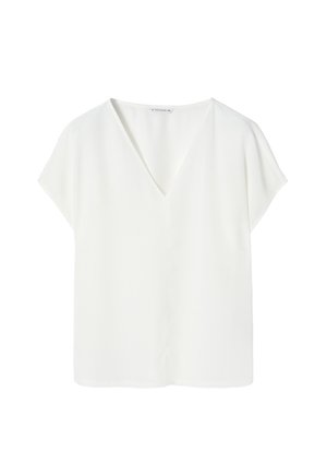 Blouse blanche à manches courtes avec un col en V et une coupe décontractée. Fabriquée à partir d'un tissu lisse et léger sans motifs ni accents visibles.