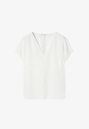 Hvid kortærmet bluse med V-hals og løs pasform. Fremstillet af et glat, let stof uden synlige mønstre eller accenter.