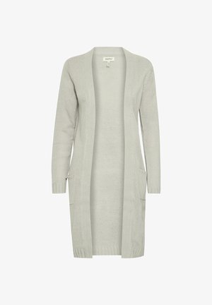 Heledhall hallukas heledashall pluus, millel on tekstureeritud kudum, avatud esiosa, kaks eesmist taskut ning ribaga äär ja varrukad.