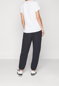 Under Armour Jogginghose - black