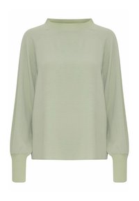 Maglia verde chiaro a maniche lunghe con scollo rotondo, maniche raglan e polsini aderenti. Realizzata in tessuto morbido e testurizzato.