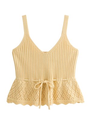 Beige gebreide mouwloze top met V-hals, geribbelde bovenste deel, diamantenpatroon aan de onderkant van de peplum en een strik aan de voorkant bij de taille.