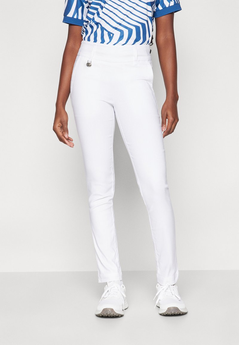 White slim-fit pants with a smooth texture and a waistband featuring a silver hardware accent, paired with a blue and white striped shirt.