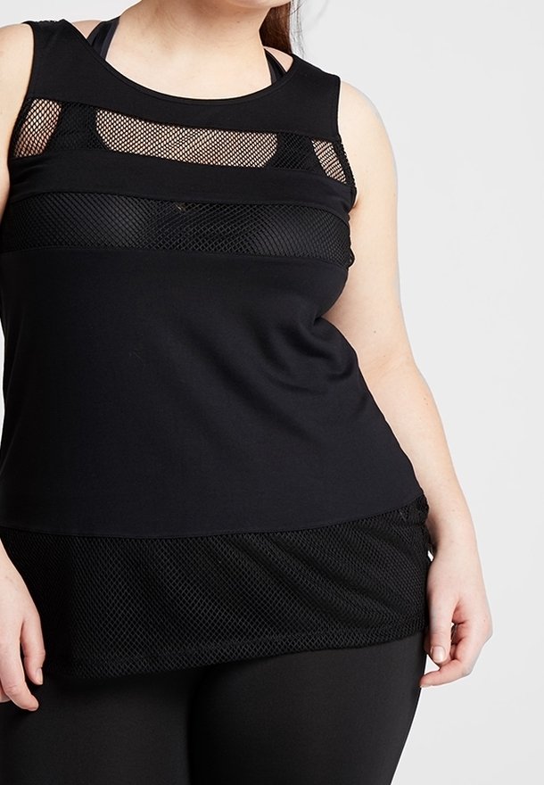 Zwarte tanktop met mesh-panelen bij de buste en de zoom. Heeft een relaxte pasvorm en een gladde stof. Accenten zijn onder andere een gelaagde textuur.