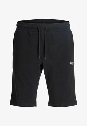 Schwarze lässige Shorts mittlerer Länge mit Kordelzugbund und kleinem weißem Logo am linken Oberschenkel.