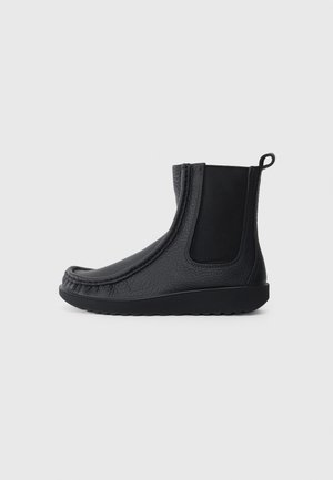 Black ankle boots made of textured leather with smooth side panels, a rounded toe, and a rubber sole featuring a tread pattern.