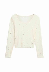 Langærmet, cropped top i creme med pink hjerteprint. Har en rund halsudskæring og blødt, tekstureret stof. Naturligt letvægts.