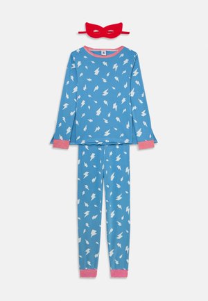 Blue long-sleeve pajama set with white lightning bolts, red-striped cuffs and collar, paired with a red cat-eye sleep mask.