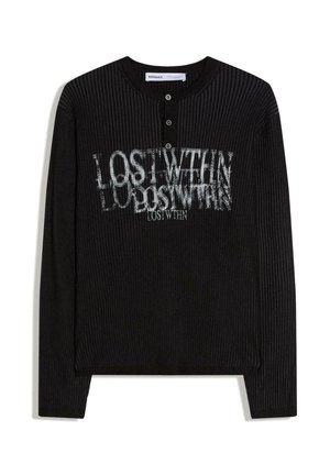 Black ribbed long-sleeve henley shirt with three buttons and white distorted text "LOST WITHIN" printed on the chest.