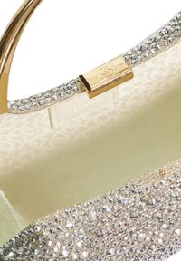 Gold and silver purse featuring a textured exterior adorned with multiple clear crystals and a smooth, satin-lined interior.