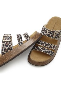 Leopard print sandals with three adjustable straps,  textured cork footbed, and a glittery brown sole. Features a metal buckle detail.