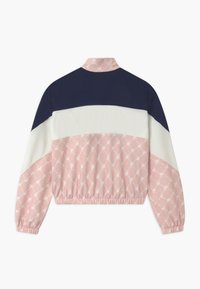 Giacca cropped con parte superiore blu navy, sezione centrale bianca e parte inferiore rosa a fantasia. Polsini e orlo elasticizzati; tessuto morbido.