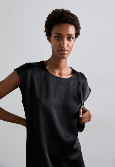 Black short-sleeve dress with a round neckline, made of smooth fabric. Features minimalistic design and subtle sheen.