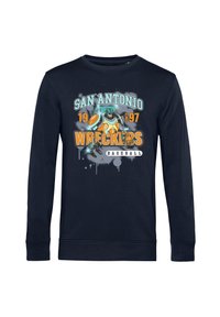 Mörkblå långärmad sweatshirt med en grafisk tryck som har "San Antonio Wreckers" och en tecknad figur i orange och teal-accenter.