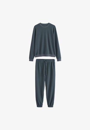 Ensemble de lounge en tissu côtelé gris foncé comprenant un sweatshirt à col ras du cou et un pantalon de jogging assorti avec taille élastique et poignets.