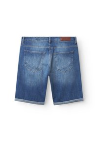 Džinsa šorti vidēji zilā krāsā ar aizlocītu apmali, piecām kabatām un ādas zīmola etiķeti uz aizmugurējās jostas daļas.