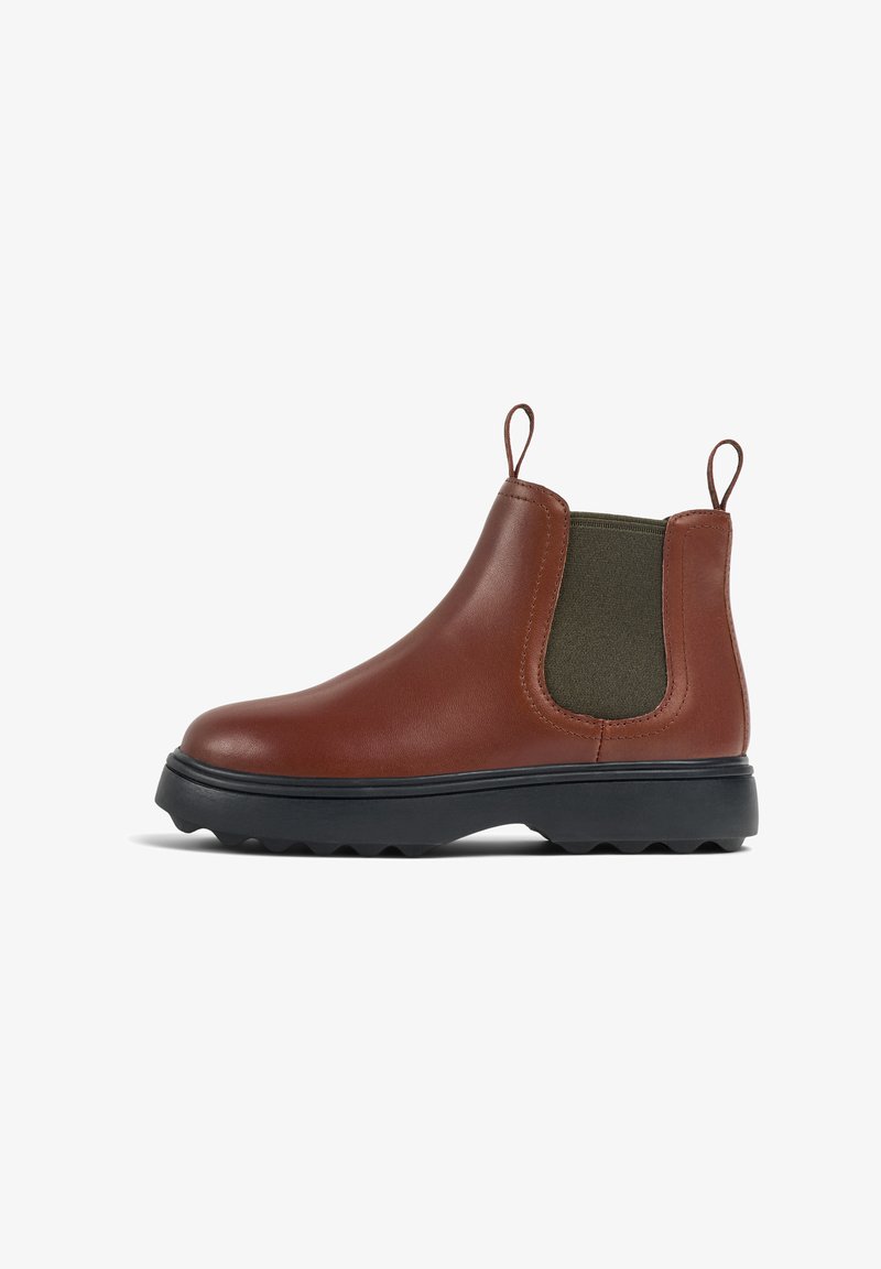 Brown leather Chelsea boot with elastic side panels, pull tabs, and a black rubber sole featuring a textured pattern for traction.