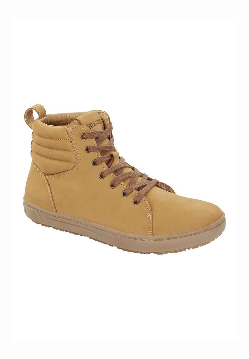 Tan high-top shoe made of smooth leather, featuring brown laces, a padded collar, and a textured rubber sole for grip.