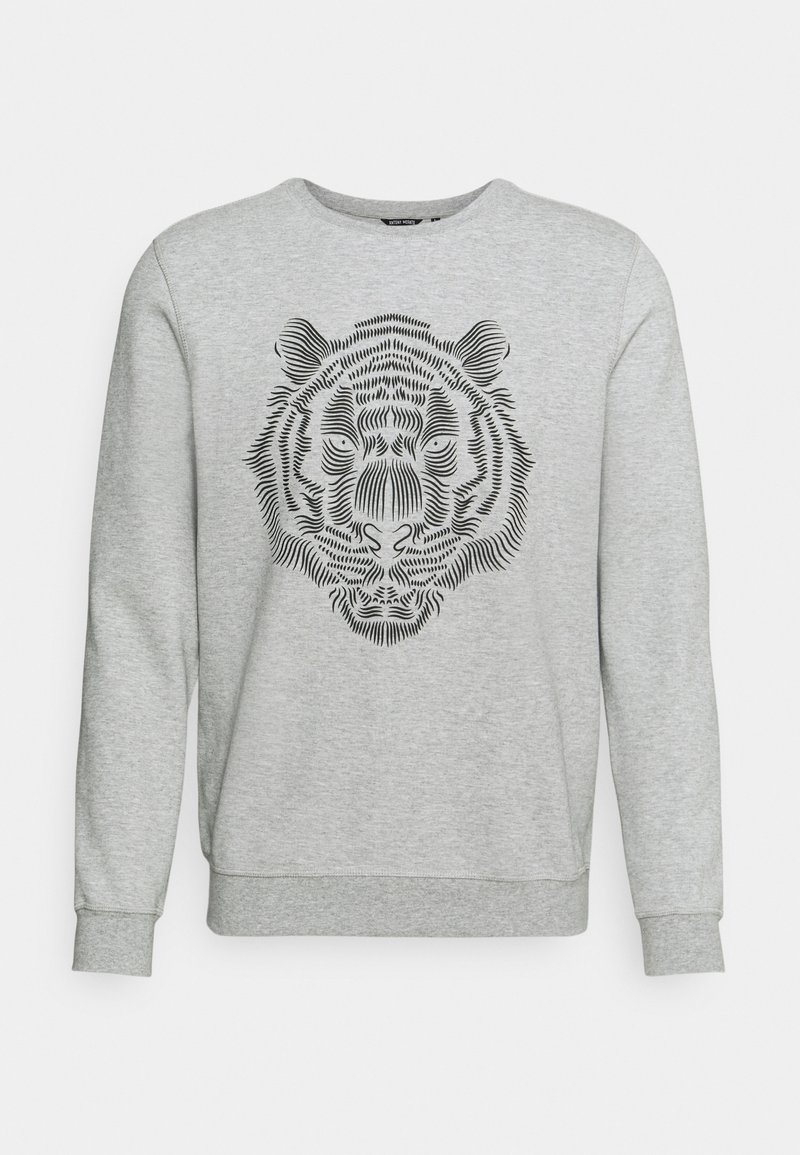 Grå sweatshirt med en svart tigeransikte-grafik tryckt i en linjär design på framsidan. Har rund halsringning och lång ärm.