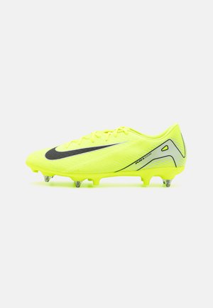 Bright yellow soccer cleat featuring a black swoosh, lightweight mesh material, streamlined design, and molded studs for traction.