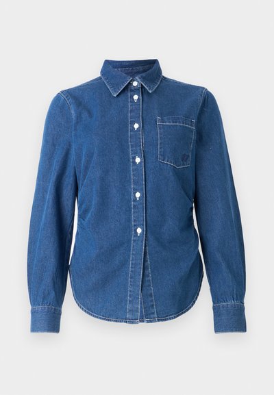 Denim button-down shirt in dark blue with long sleeves, a collar, a single chest pocket, and white buttons. Light stitching adds detail.
