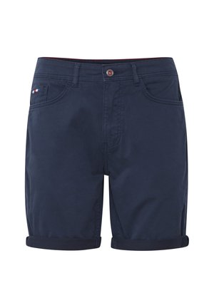 Marinblå bomullsshorts med rullekanter, med to frontlommer og et fargerikt merke på venstre lomme. Enkelt, rettsnittet design.