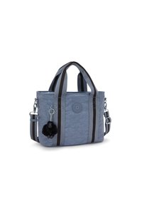 Sininen tilkkutäkki käsilaukku mustilla ja harmailla raidallisilla kahvoilla. Irrotettava karvapehmuste, jossa on pieni apinahahmo. Mukana säädettävä olkahihna.