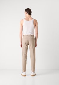 BOSS TAPERED - Trousers - light beige