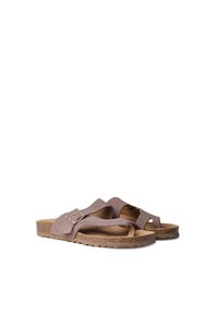 Brown suede slide sandals with cut-out design and buckle accent; cork footbed and textured rubber sole provide comfort and support.