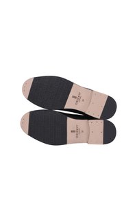 Suola nera con un motivo testurizzato che presenta il logo "CRICKIT", inserto in pelle marrone chiaro e tallone rinforzato con puntini per una maggiore aderenza. Taglia 37.