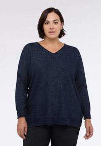 Maglione a scollo a V blu navy realizzato in materiale scintillante, con maniche lunghe, polsini a costine e vestibilità comoda con spacchi laterali all'orlo.