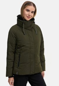 Olive green puffer jacket with a high collar, zippered pockets, and drawstring hood. Features quilted texture and soft fur lining.