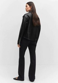 Mango Veste en similicuir - black